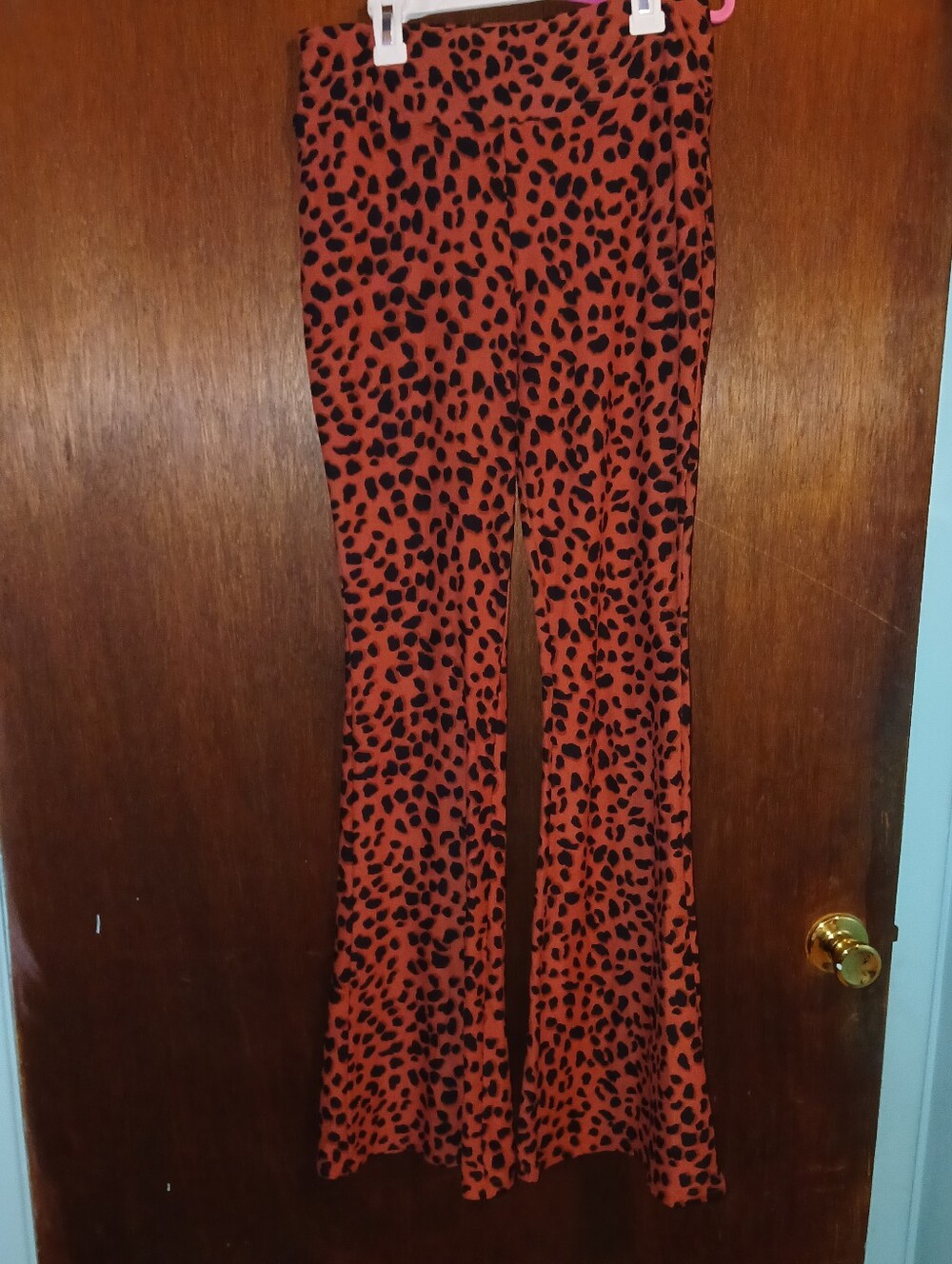 No Boundaries Burnt Orange and Black Cheetah Print Bell Bottom Leggings